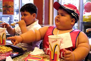 In this file photo, the media uses a photo of a morbidly obese boy to cravenly contribute to the cycle of childhood obesity.